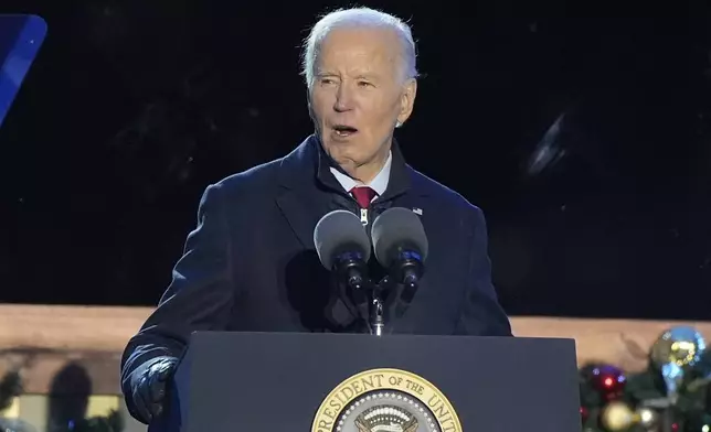 President Joe Biden speaks during a ceremony to light the National Christmas Tree on the Ellipse near the White House in Washington, Thursday, Dec. 5, 2024. (AP Photo/Mark Schiefelbein)