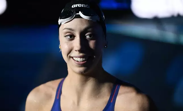 Gretchen Walsh of the USA smiles after setting a world record during a 50-meter butterfly semifinal during the World Short Course Swimming Championships in Budapest, Hungary, Tuesday, Dec. 10, 2024. (AP Photo/Denes Erdos)