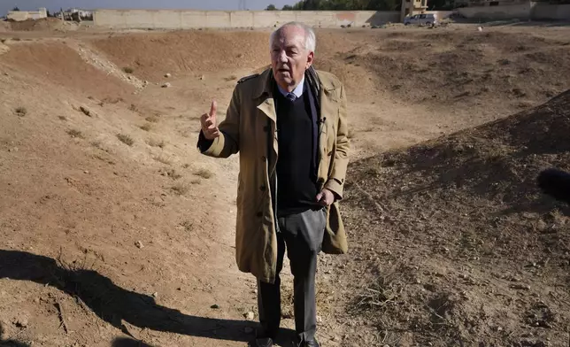 Ambassador Stephen Rapp, a former ambassador at large for war crimes and international prosecutor, visits a location identified as a mass grave for detainees killed under rule of Bashar Assad, southern Damascus, Syria, Tuesday, Dec. 17, 2024. (AP Photo/Hussein Malla)