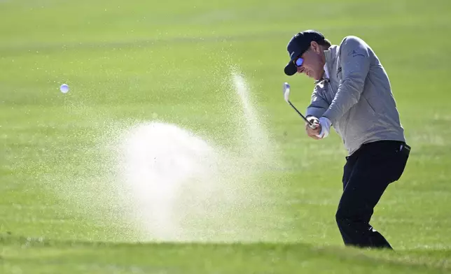 Justin Leonard hits out of a bunker onto the third green during the first round of the PNC Championship golf tournament, Saturday, Dec. 21, 2024 in Orlando, Fla. (AP Photo/Phelan M. Ebenhack)