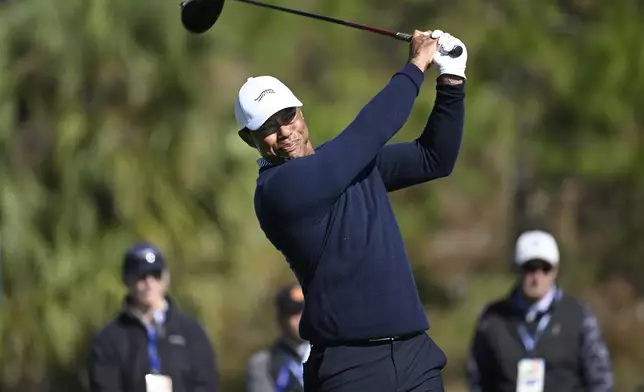 Tiger Woods tees off on the fifth hole during the first round of the PNC Championship golf tournament, Saturday, Dec. 21, 2024 in Orlando. (AP Photo/Phelan M. Ebenhack)