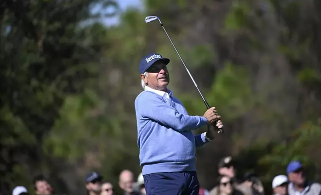 Fred Couples watches his tee shot on the fourth hole during the first round of the PNC Championship golf tournament, Saturday, Dec. 21, 2024 in Orlando. (AP Photo/Phelan M. Ebenhack)