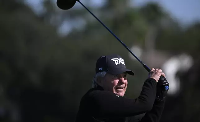 Gary Player, of South Africa, watches his tee shot on the fifth hole during the first round of the PNC Championship golf tournament, Saturday, Dec. 21, 2024 in Orlando. (AP Photo/Phelan M. Ebenhack)