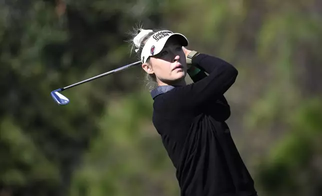 Nelly Korda watches her tee shot on the fourth hole during the first round of the PNC Championship golf tournament, Saturday, Dec. 21, 2024 in Orlando. (AP Photo/Phelan M. Ebenhack)