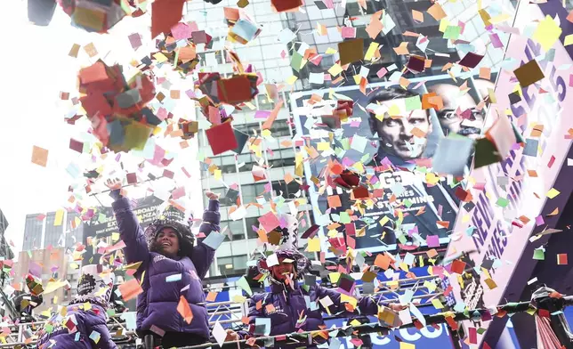 Organizers throw confetti ahead of New Year's Eve in Times Square, Sunday, Dec. 29, 2024, in New York. (AP Photo/Heather Khalifa)