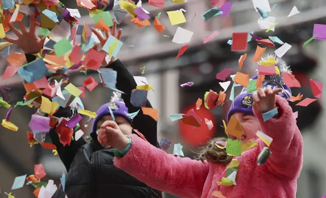 Organizers throw confetti ahead of New Year's Eve in Times Square, Sunday, Dec. 29, 2024, in New York. (AP Photo/Heather Khalifa)