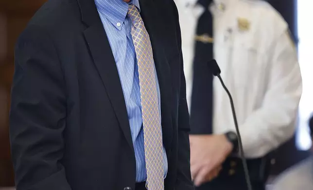 Defense attorney Larry Tipton makes a motion for cell phone and text messages between Cohasset police officers and State Police Detective Michael Proctor during the Brian Walshe trial at the Norfolk Superior Court in Dedham, Mass. Monday, Dec. 2, 2024. (Greg Derr/The Patriot Ledger via AP)