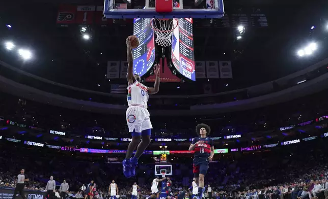 Philadelphia 76ers' Tyrese Maxey goes up for a shot during the first half of an NBA basketball game against the Washington Wizards, Wednesday, Jan. 8, 2025, in Philadelphia. (AP Photo/Matt Slocum)