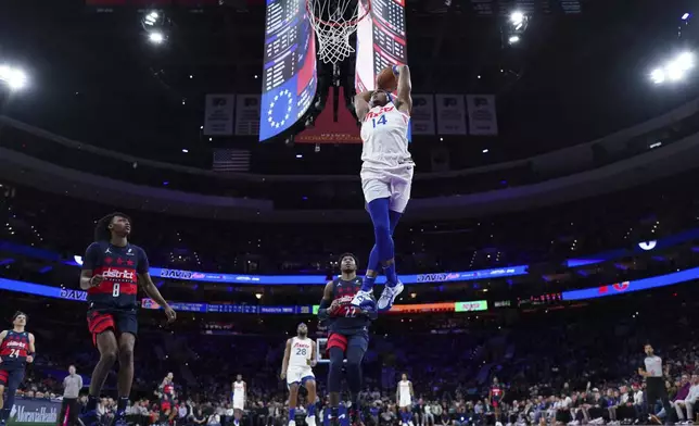 Philadelphia 76ers' Ricky Council IV tries to dunk during the first half of an NBA basketball game against the Washington Wizards, Wednesday, Jan. 8, 2025, in Philadelphia. (AP Photo/Matt Slocum)