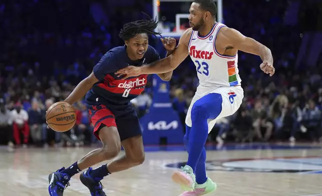 Washington Wizards' Carlton Carrington, left, tries to get past Philadelphia 76ers' Eric Gordon during the first half of an NBA basketball game, Wednesday, Jan. 8, 2025, in Philadelphia. (AP Photo/Matt Slocum)