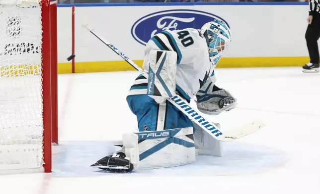 San Jose Sharks goaltender Alexandar Georgiev (40) cannot stop a goal by New York Islanders center Brock Nelson during the second period of an NHL hockey game, Saturday, Jan. 18, 2025, in Elmont, N.Y. (AP Photo/Corey Sipkin).