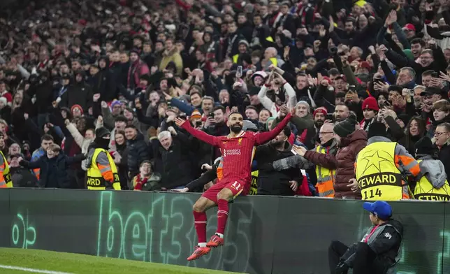 Liverpool's Mohamed Salah celebrates after scoring his side's first goal during the Champions League, opening phase soccer match between Liverpool and Lille at Anfield Stadium, Liverpool, England, Tuesday, Jan.21, 2025. (AP Photo/Jon Super)