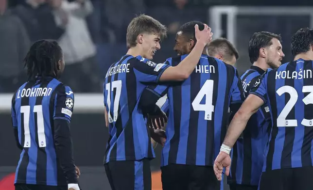 Atalanta's Charles De Ketelaere, second from let, celebrates with teammates after scoring during the Champions League opening phase soccer match between Atalanta and Sturm Graz at the Gewiss Stadium in Bergamo, Italy, Tuesday, Jan. 21 , 2025. (Stefano Nicoli/LaPresse via AP)