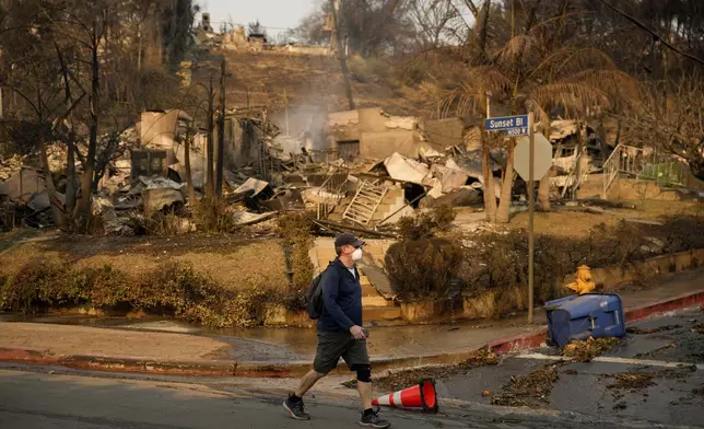 A property is destroyed by the Palisades Fire along Sunset Boulevard in the Pacific Palisades neighborhood of Los Angeles, Friday, Jan. 10, 2025. (AP Photo/John Locher)