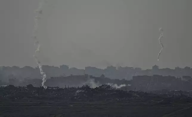 An Israeli army flare is seen over the Gaza Strip, as seen from Sderot, southern Israel, Monday, Jan. 6, 2025. (AP Photo/Tsafrir Abayov)