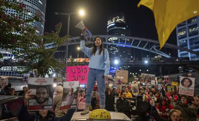 Israelis protest against Prime Minister Benjamin Netanyahu's government and call for the release of hostages held in the Gaza Strip by the Hamas militant group, in Tel Aviv, Israel, Monday, Jan. 6, 2025. (AP Photo/Ohad Zwigenberg)