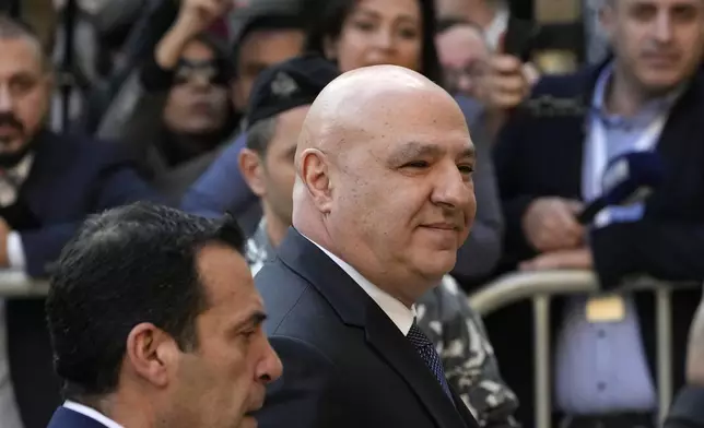 Newly-elected Lebanese President Joseph Aoun smiles upon his arrival at the Lebanese Parliament to be sworn in as a new president, in Beirut, Lebanon, Thursday, Jan. 9, 2025. (AP Photo/Hussein Malla)