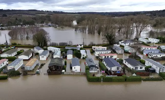 A view of flood waters around the Little Venice caravan park in Yalding, Kent, England, Monday, Jan. 6, 2025. (Gareth Fuller/PA via AP)