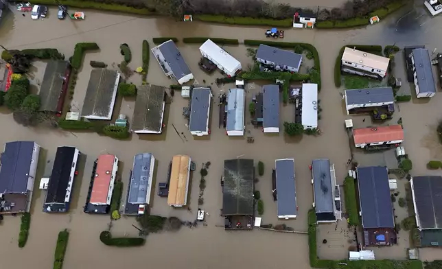 A view of flood waters around the Little Venice caravan park in Yalding, Kent, England, Monday, Jan. 6, 2025. (Gareth Fuller/PA via AP)