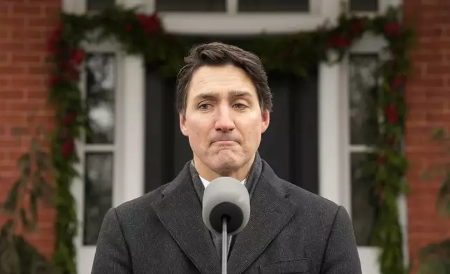 Canada Prime Minister Justin Trudeau makes an announcement outside Rideau Cottage in Ottawa on Monday, Jan. 6, 2025. (Adrian Wyld/The Canadian Press via AP)