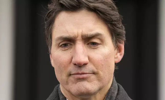 Prime Minister Justin Trudeau makes an announcement outside Rideau Cottage in Ottawa on Monday, Jan. 6, 2025. (Adrian Wyld/The Canadian Press via AP)