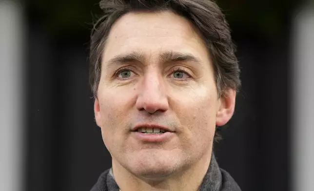 Canada Prime Minister Justin Trudeau makes an announcement outside Rideau Cottage in Ottawa on Monday, Jan. 6, 2025. (Adrian Wyld/The Canadian Press via AP)