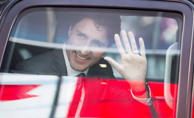 FILE - Prime Minister Justin Trudeau waves as he leaves the offices of Salesforce on Feb. 8, 2018, in San Francisco. (Ryan Remiorz/The Canadian Press via AP, File)