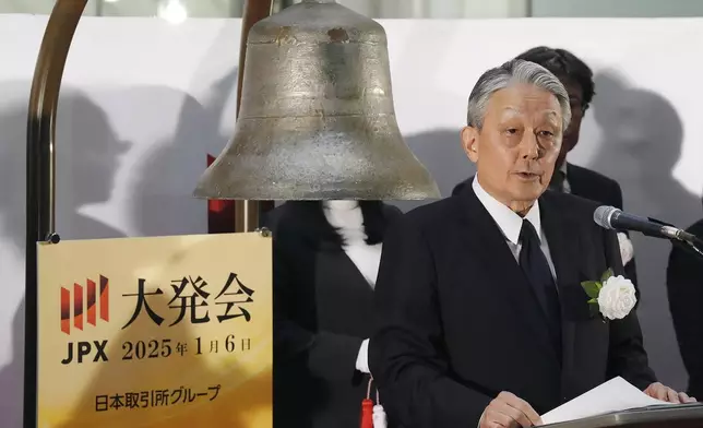 Hiromi Yamaji, left, CEO of Japan Exchange Group (JPX) delivers a speech during a ceremony marking the start of this year's trading Monday, Jan. 6, 2025, in Tokyo. (AP Photo/Eugene Hoshiko)