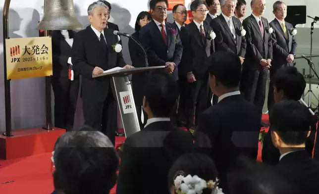 Hiromi Yamaji, left, CEO of Japan Exchange Group (JPX) delivers a speech during a ceremony marking the start of this year's trading Monday, Jan. 6, 2025, in Tokyo. (AP Photo/Eugene Hoshiko)