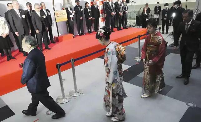 Kimono-clad employees of the Tokyo Stock Exchange and guests leave the venue after a ceremony marking the start of this year's trading Monday, Jan. 6, 2025, in Tokyo. (AP Photo/Eugene Hoshiko)