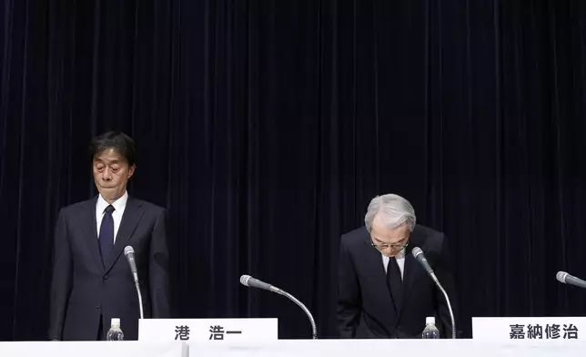 Koichi Minato, president and CEO of Fuji Television Network, left, and Shuji Kano, Fuji Media Holdings COB, announce their resignation during a news conference at the Fuji Television headquarters in Tokyo, Monday, Jan. 27, 2025. (AP Photo/Eugene Hoshiko)