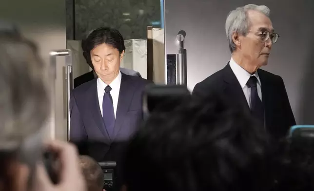 From left, Koichi Minato, President and CEO of Fuji Television Network, and Shuji Kano, Fuji Media Holdings COB, arrive for a press conference at Fuji Television headquarter in Tokyo, Monday, Jan. 27, 2025. (AP Photo/Eugene Hoshiko)