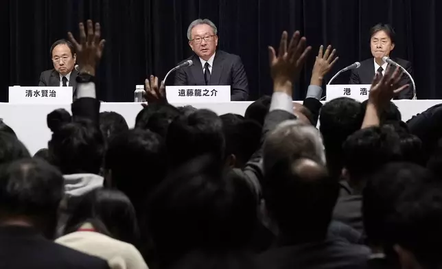 From left, Kenji Shimizu, newly appointed president and CEO of Fuji Television Network, Ryunosuke Endo, vice chairman of the Board of Fuji Television Network, and Koichi Minato, outgoing president and CEO of Fuji Television Network, attend a news conference at the Fuji Television headquarters in Tokyo, Monday, Jan. 27, 2025. (AP Photo/Eugene Hoshiko)