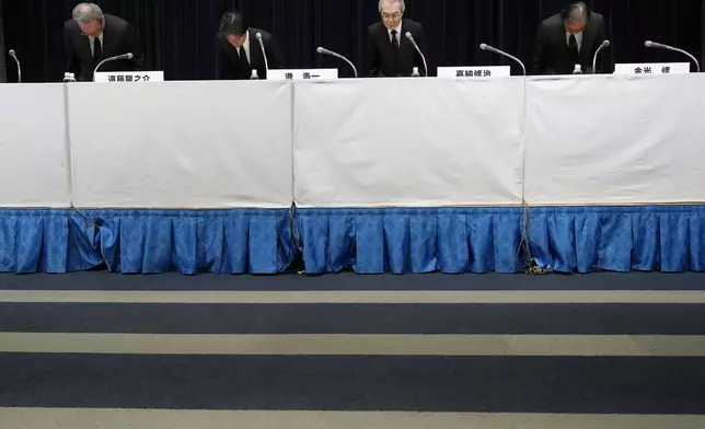Ryunosuke Endo, from left, vice chairman of the Board of Fuji Television Network, Koichi Minato, president and CEO of Fuji Television Network, Shuji Kano, Fuji Media Holdings COB, Osamu Kanemitsu, president and CEO of Fuji Media Holdings, bow during a news conference at the Fuji Television headquarters in Tokyo, Monday, Jan. 27, 2025. (AP Photo/Eugene Hoshiko)