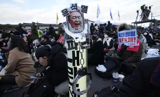 An image of impeached South Korean President Yoon Suk Yeol is displayed during a rally demanding immediate indictment of Yoon in Seoul, South Korea, Saturday, Jan. 25, 2025. The letters read "Yoon Suk Yeol." (AP Photo/Ahn Young-joon)
