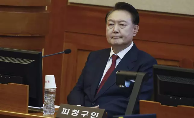 FILE- South Korea's impeached President Yoon Suk Yeol attends the fourth hearing of his impeachment trial over his short-lived imposition of martial law at the Constitutional Court in Seoul, South Korea, Thursday, Jan. 23, 2025. (Jeon Heon Kyun/Pool Photo via AP, File)