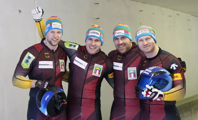 Francesco Friedrich, Matthias Sommer, Alexander Schueller and Felix Straub, of Germany, pose after their second run in the 4-man bobsleigh at the Bobsleigh World Cup in Innsbruck, Austria, Sunday, Jan. 19, 2025. (AP Photo/Matthias Schrader)