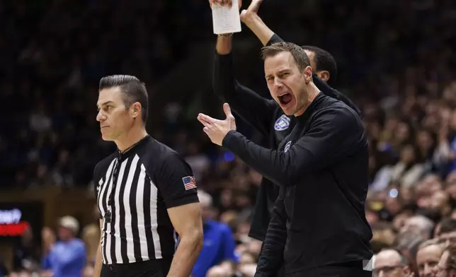 Duke head coach Jon Scheyer reacts to a call during the first half of an NCAA college basketball game against Pittsburgh in Durham, N.C., Tuesday, Jan. 7, 2025. (AP Photo/Ben McKeown)