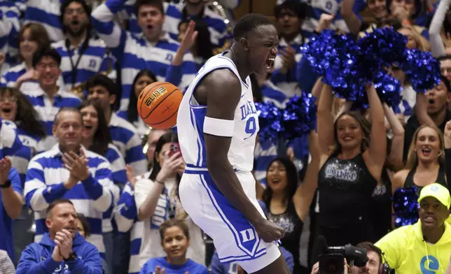 Duke's Khaman Malauch reacts after a dunk during the first half of an NCAA college basketball game against Pittsburgh in Durham, N.C., Tuesday, Jan. 7, 2025. (AP Photo/Ben McKeown)