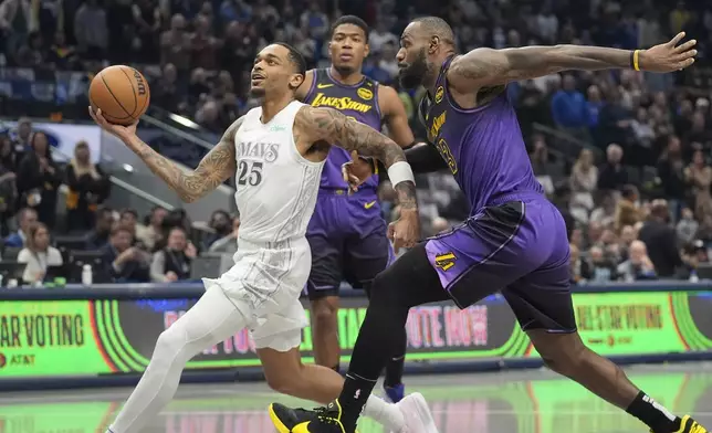 Dallas Mavericks forward P.J. Washington (25) drives past Los Angeles Lakers forward LeBron James (23) during the first half of an NBA basketball game Tuesday, Jan. 7, 2025, in Dallas. (AP Photo/LM Otero)