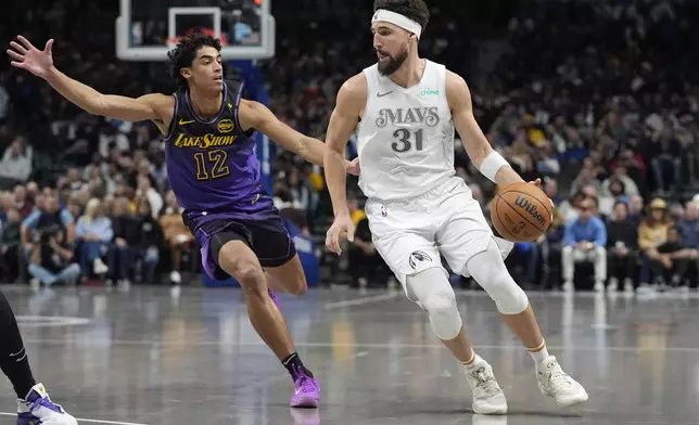 Dallas Mavericks guard Klay Thompson (31) drives against Los Angeles Lakers guard Max Christie (12) during the first half of an NBA basketball game, Tuesday, Jan. 7, 2025, in Dallas. (AP Photo/LM Otero)