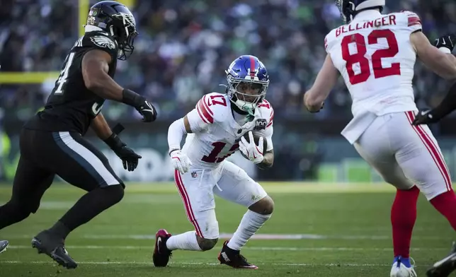 New York Giants wide receiver Wan'Dale Robinson (17) runs with the ball during the second half of an NFL football game against the Philadelphia Eagles on Sunday, Jan. 5, 2025, in Philadelphia. (AP Photo/Matt Slocum)