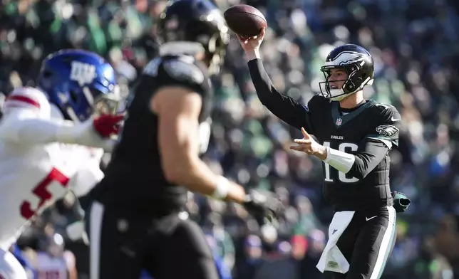 Philadelphia Eagles quarterback Tanner McKee (16) throws to Philadelphia Eagles wide receiver Ainias Smith for a touchdown during the first half of an NFL football game against the New York Giants on Sunday, Jan. 5, 2025, in Philadelphia. (AP Photo/Matt Slocum)