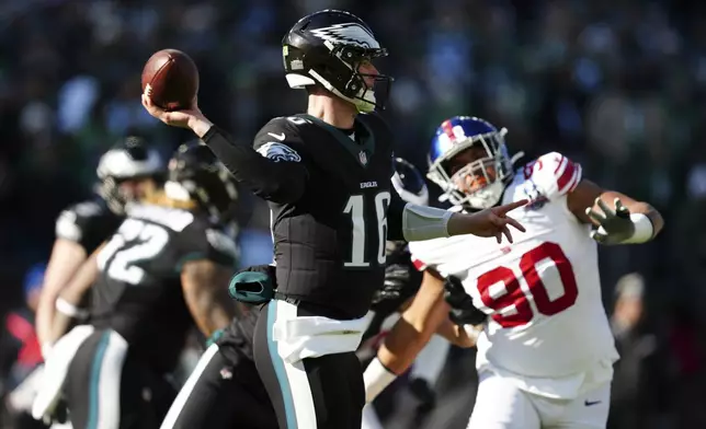 Philadelphia Eagles quarterback Tanner McKee (16) throws during the first half of an NFL football game against the New York Giants on Sunday, Jan. 5, 2025, in Philadelphia. (AP Photo/Derik Hamilton)