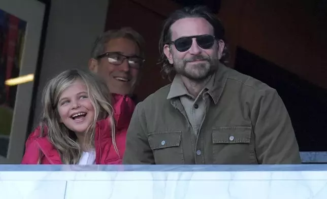 Actor Bradley Cooper watches action during the second half of an NFL football game between the Philadelphia Eagles and the New York Giants on Sunday, Jan. 5, 2025, in Philadelphia. (AP Photo/Chris Szagola)