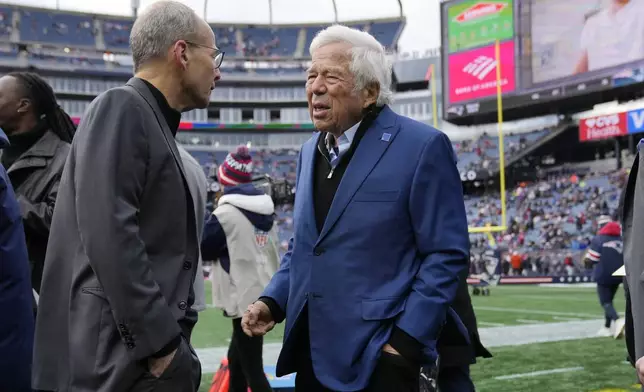 New England Patriots owner Robert Kraft, right, talks with his son Jonathan prior to an NFL football game against the Buffalo Bills, Sunday, Jan. 5, 2025, in Foxborough, Mass. (AP Photo/Robert F. Bukaty)