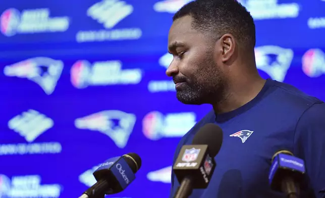 New England Patriots head coach Jerod Mayo departs after answering questions following an NFL football game against the Buffalo Bills, Sunday, Jan. 5, 2025, in Foxborough, Mass. Mayo was fired shortly after the news conference. (AP Photo/Steven Senne)