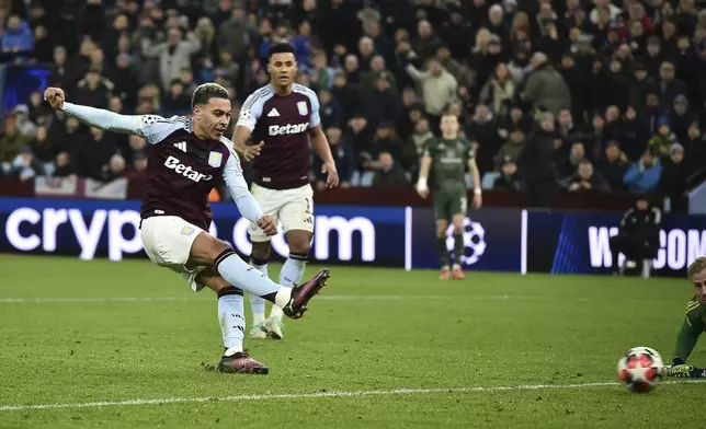 Aston Villa's Morgan Rogers scores his side's fourth goal during the Champions League opening phase soccer match between Aston Villa and Celtic at Villa Park in Birmingham, England, Wednesday, Jan. 29, 2025. (AP Photo/Rui Vieira)