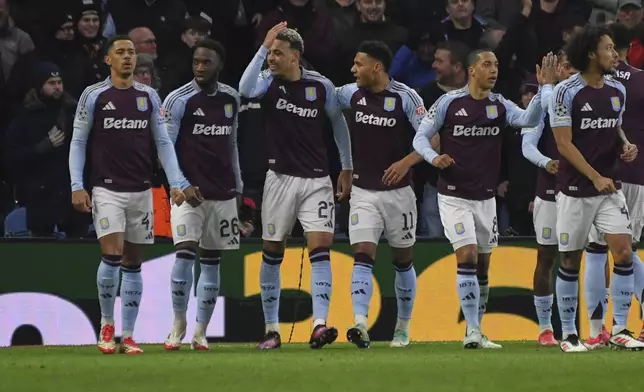 Aston Villa's Morgan Rogers, third left, celebrates with teammates after scoring his side's second goal during the Champions League opening phase soccer match between Aston Villa and Celtic at Villa Park in Birmingham, England, Wednesday, Jan. 29, 2025. (AP Photo/Rui Vieira)