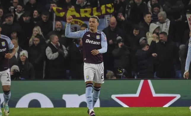 Aston Villa's Morgan Rogers celebrates after scoring the opening goal of his team during the Champions League opening phase soccer match between Aston Villa and Celtic at Villa Park in Birmingham, England, Wednesday, Jan. 29, 2025. (AP Photo/Rui Vieira)